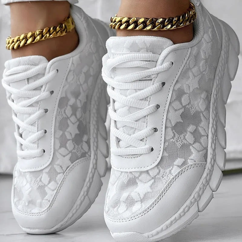Women's casual canvas running shoes in white, shown from the side on a plain background.