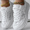 Women's casual canvas running shoes in white, shown from the side on a plain background.