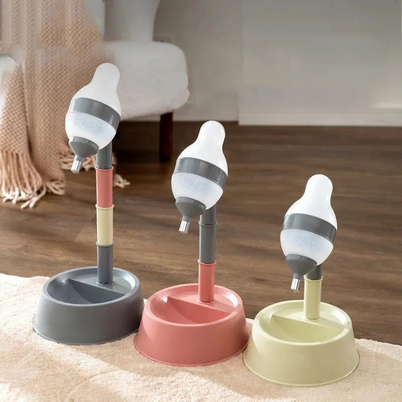Green adjustable pet water dispenser with detachable pole and steel drinking nozzle on a grey floor.