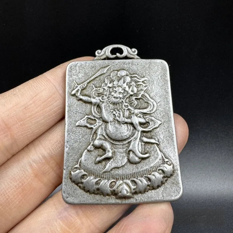 Chinese-style cast iron pendant ornament with Aryaacalanatha Yamantaka geometric design.