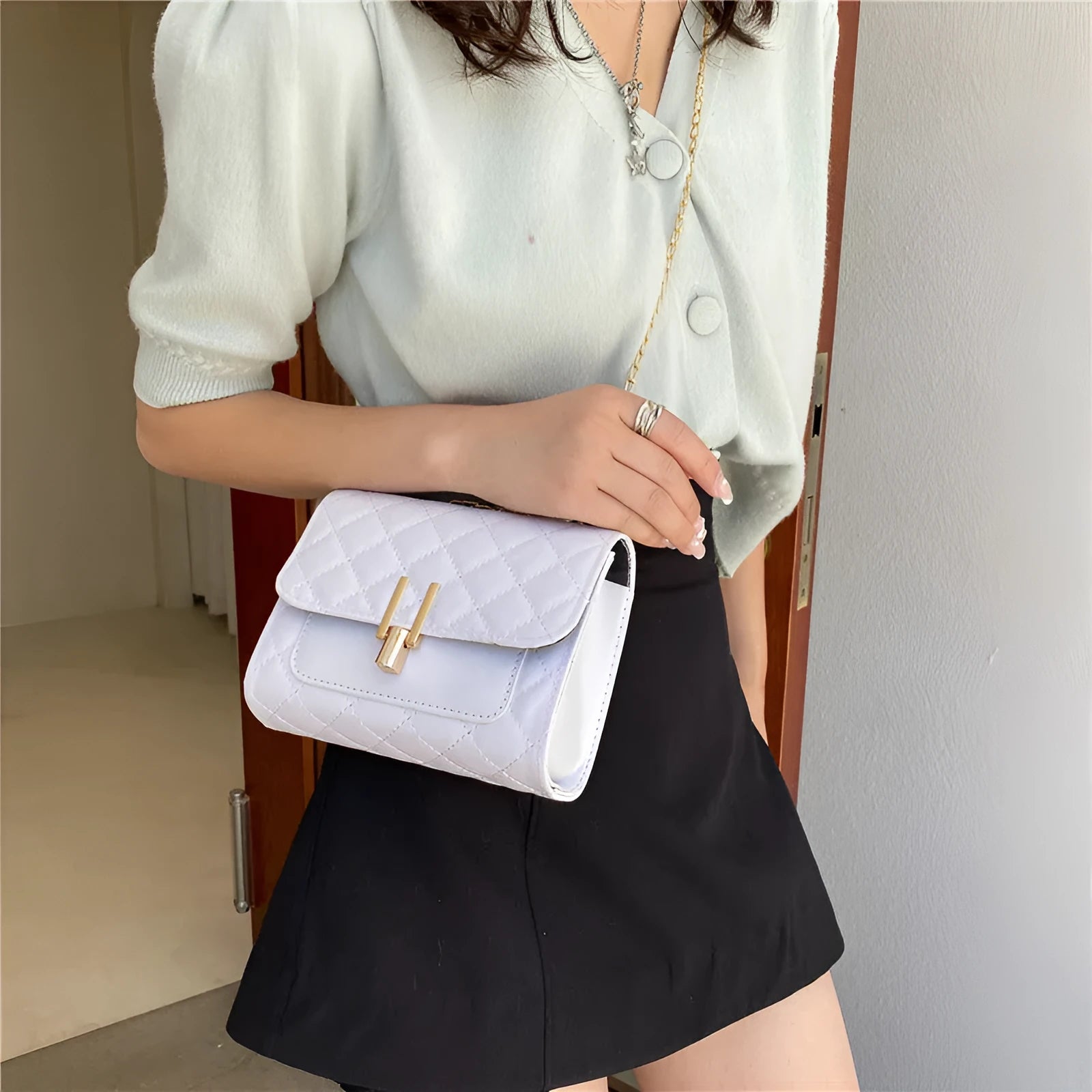 Women's white diamond lattice chain crossbody bag with adjustable shoulder strap showing dimensions