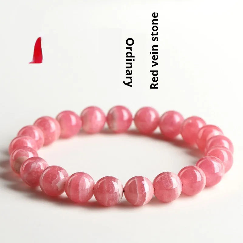 Women's crystal bracelet with geometric red stone beads and longevity lock charm