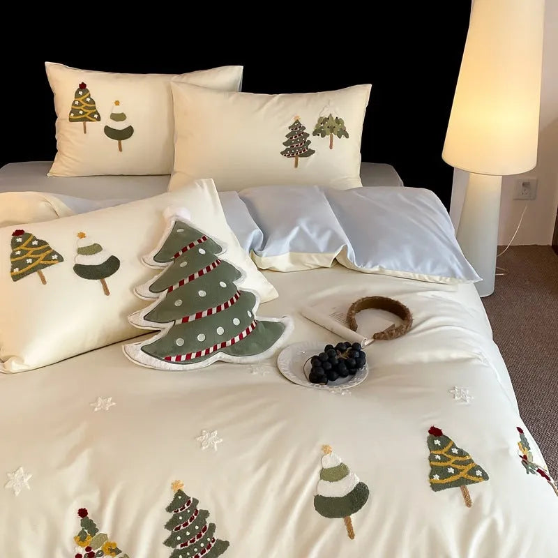 Cream Blue cotton duvet cover with embroidered Christmas tree and flower design, part of a four-piece bedding set.