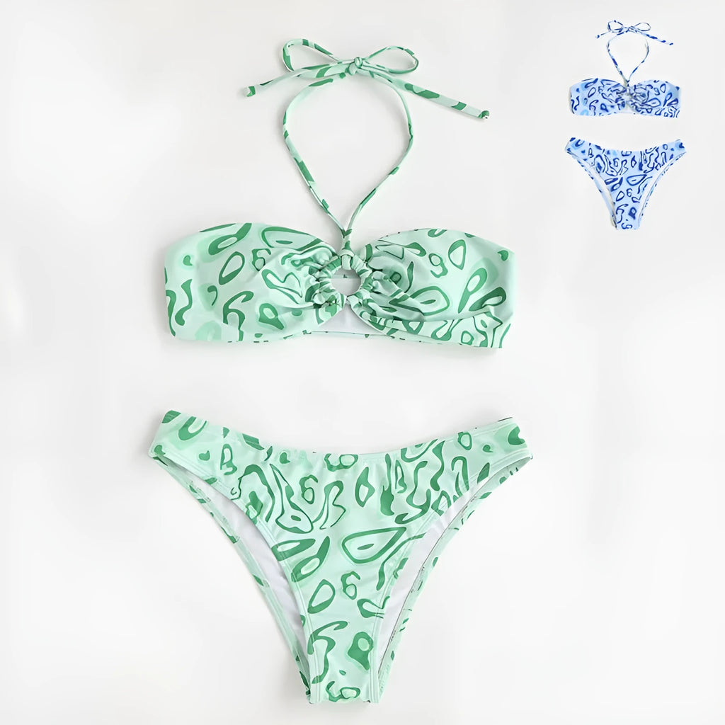 Green floral bandeau bikini swimsuit set with briefs on a neutral background.
