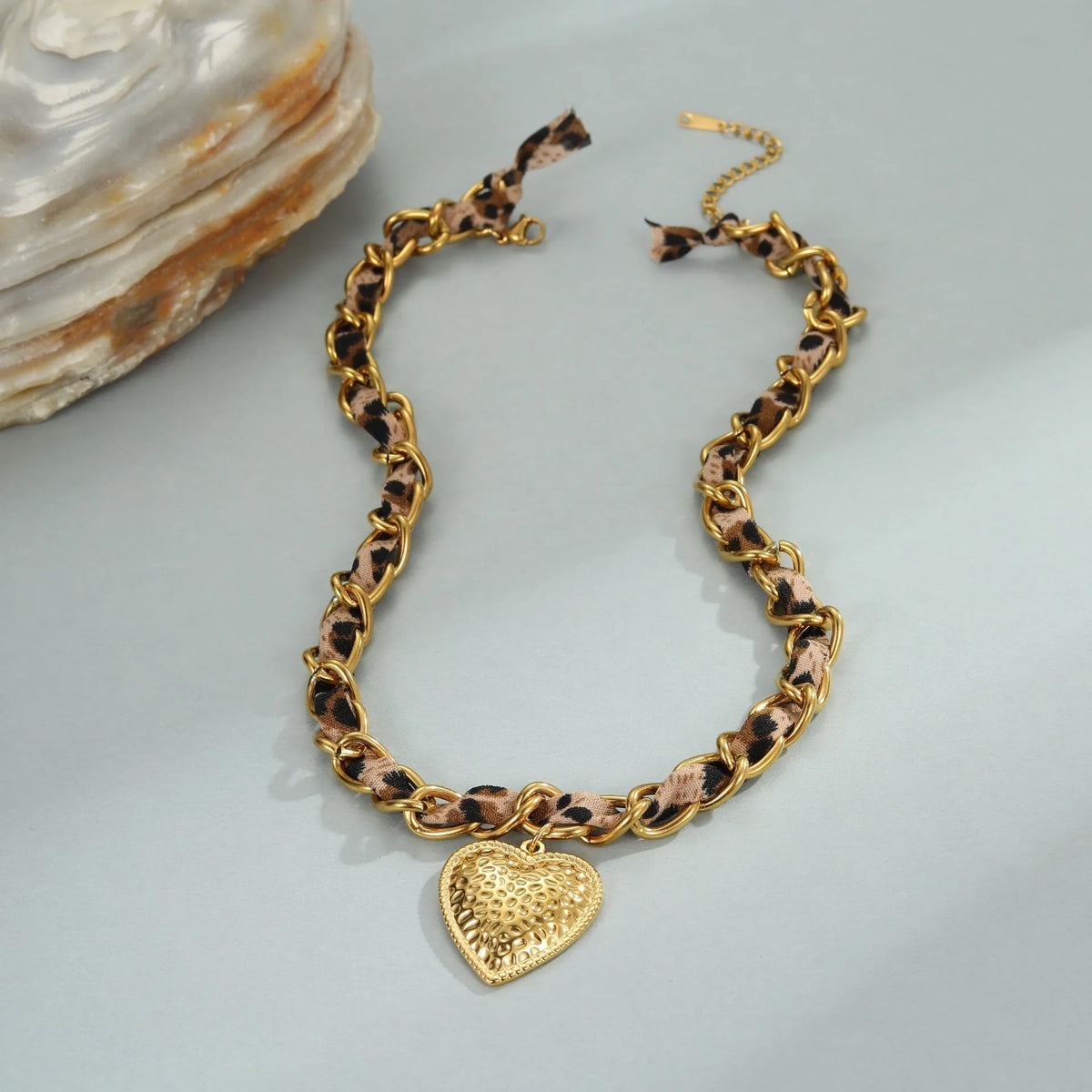 Women's stainless steel necklace with geometric leopard love pendant on adjustable chain