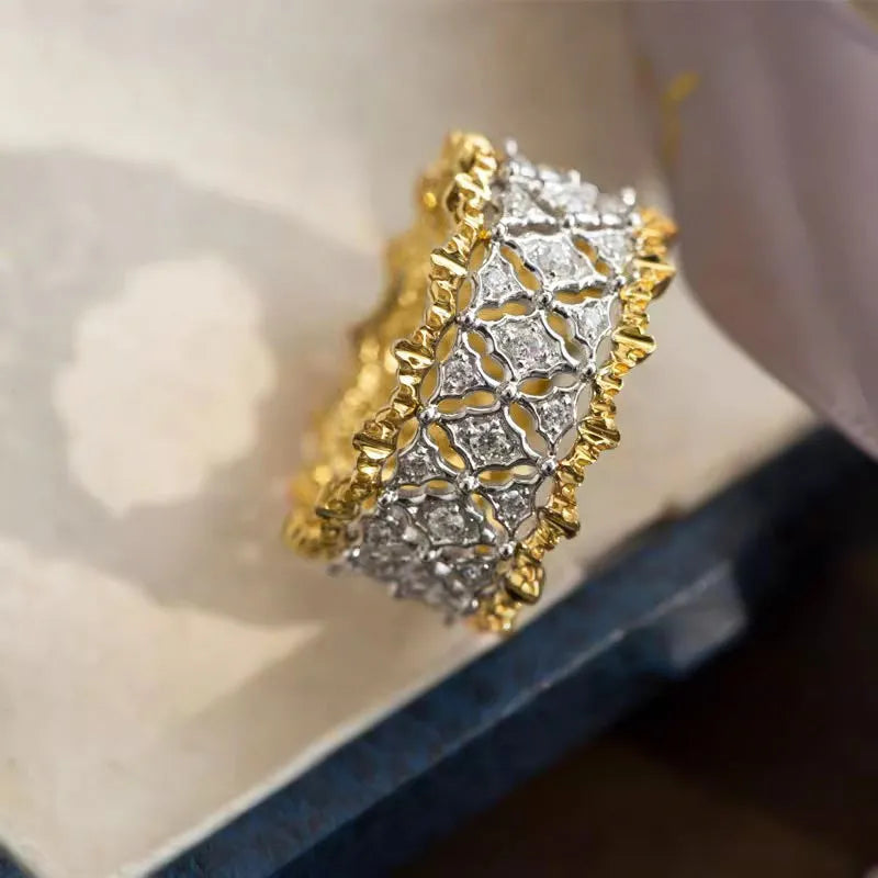 Two-tone gold geometric ring with round zircon detail on copper construction