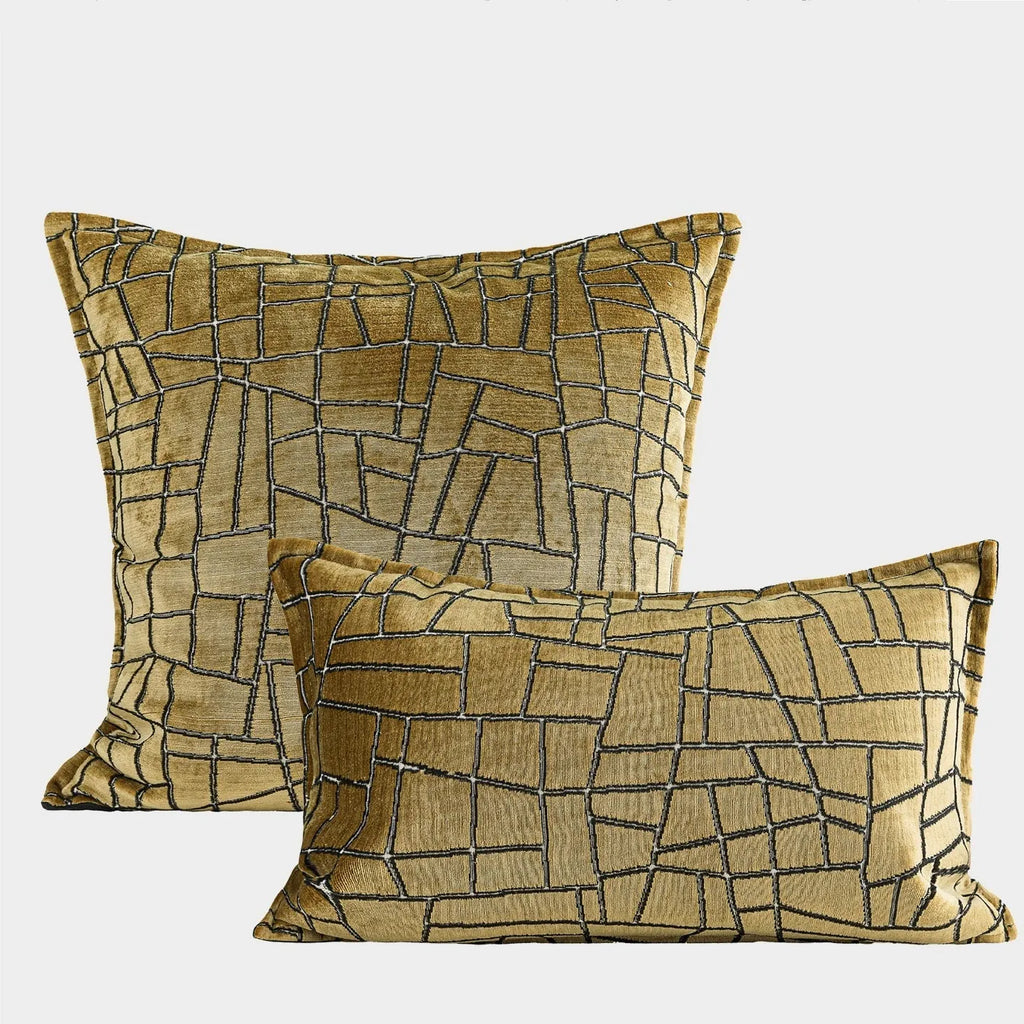 Tuhao gold geometric abstract pattern on a velvet square cushion cover and lumbar pillow.