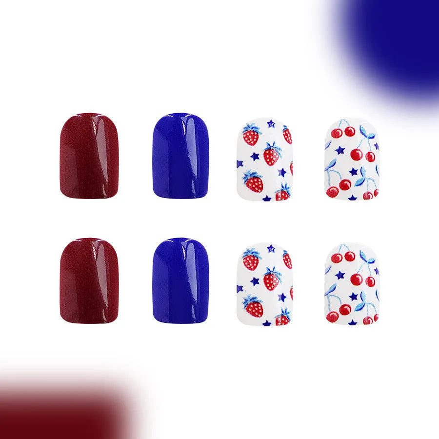 Short glossy press-on nails with strawberry and cherry图案 in red and blue colours