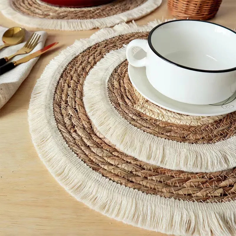 Round papyrus placemat with corn rope tassel edge in solid natural colour, available in multiple sizes.
