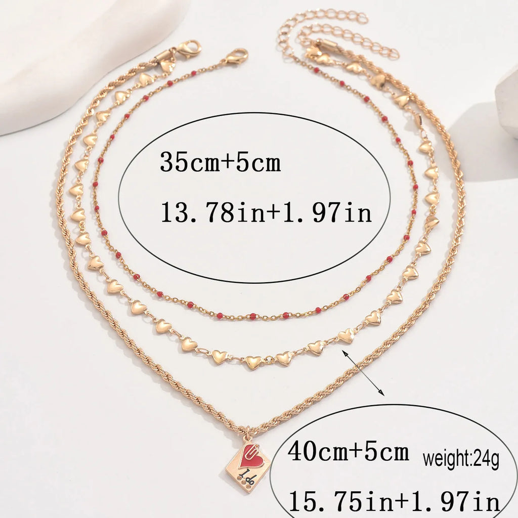 Golden three-layer adjustable clavicle chain necklace with geometric heart pendant