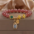 Red strawberry quartz beaded bracelet with alloy metal and rhinestone detailing for women's jewellery