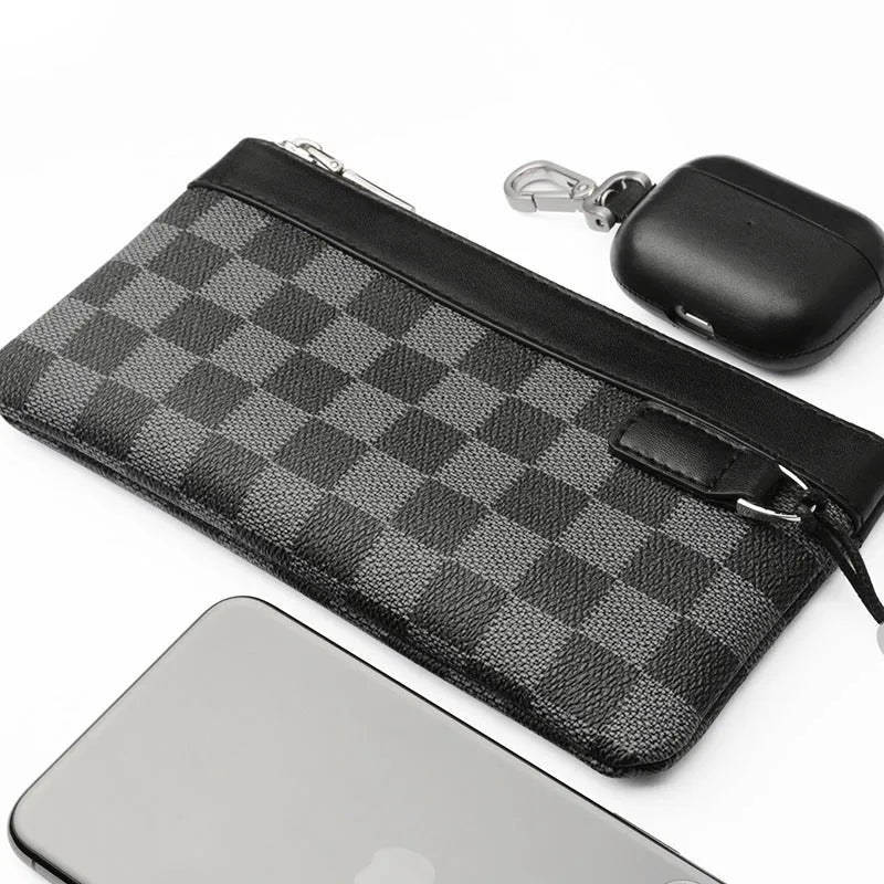 Black men's clutch wallet made from first layer cowhide leather, showing front view.