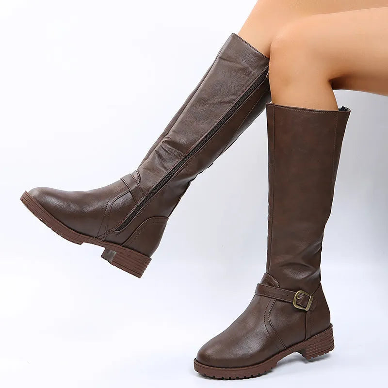 Women's black knight boots with a square heel, buckle detail on the upper, and a high shaft.