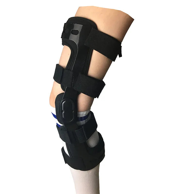 Black anterior ligament knee pad showing multi-material construction and sizing tags for left and right knees.