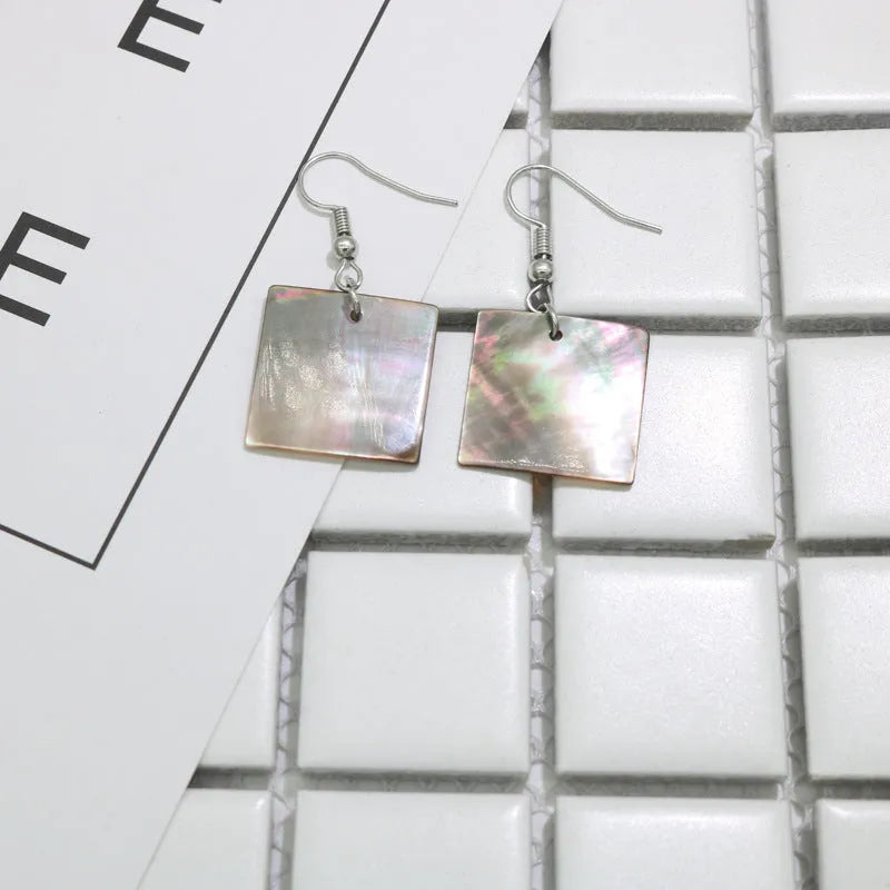 Women's geometric shell earrings in Square Panther and Rectangular Shell colours with retro natural styling