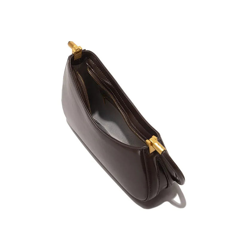 Women's oval underarm handbag in PU material with single strap and zippered compartment