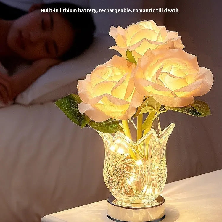 Modern crystal flowers design rechargeable touch table lamp on a bedside table.