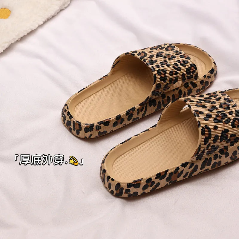 Women's leopard print slippers with thick EVA sole in black, pink, khaki, and white zebra print.