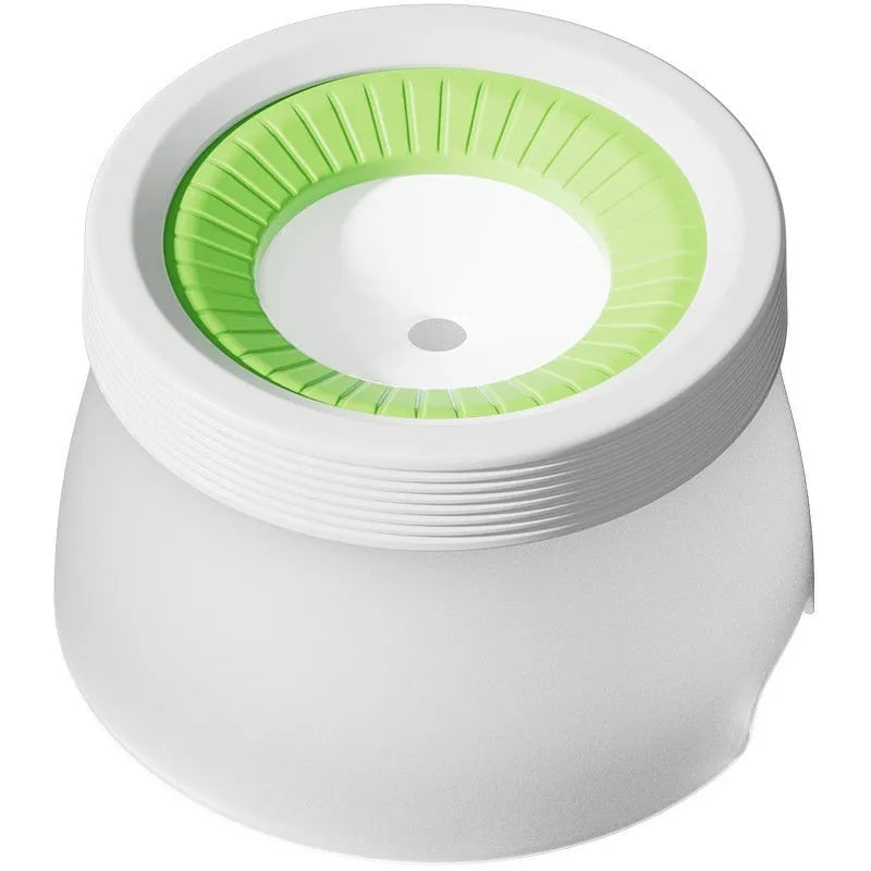 Green pet suspension bowl with non-wet mouth design for cats and dogs on white plate