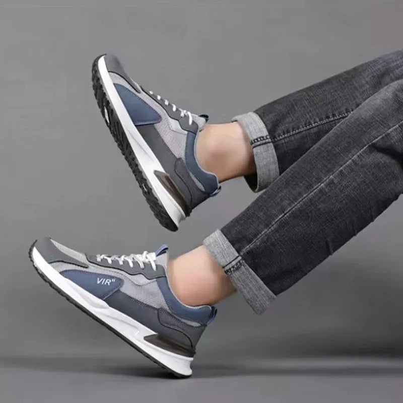 Men's colour block mesh lace-up running shoes in black, grey and white on a white background.