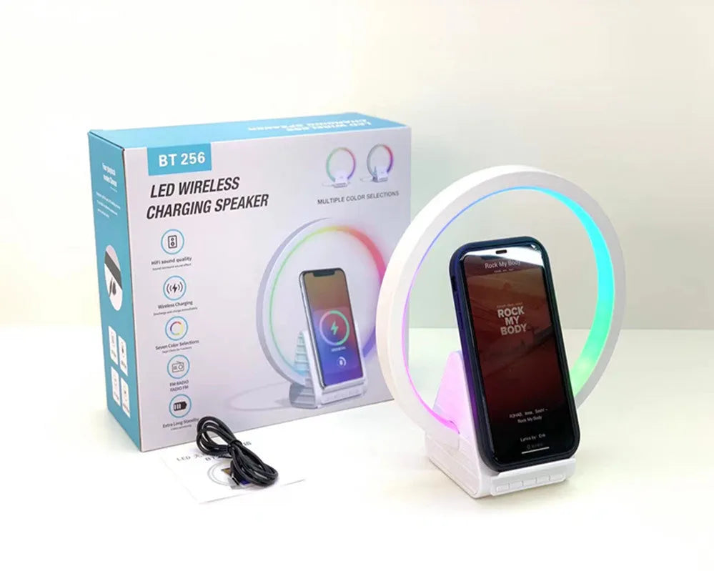 White Bluetooth speaker with wireless charging pad and ambient lighting, 225mm by 200mm dimensions