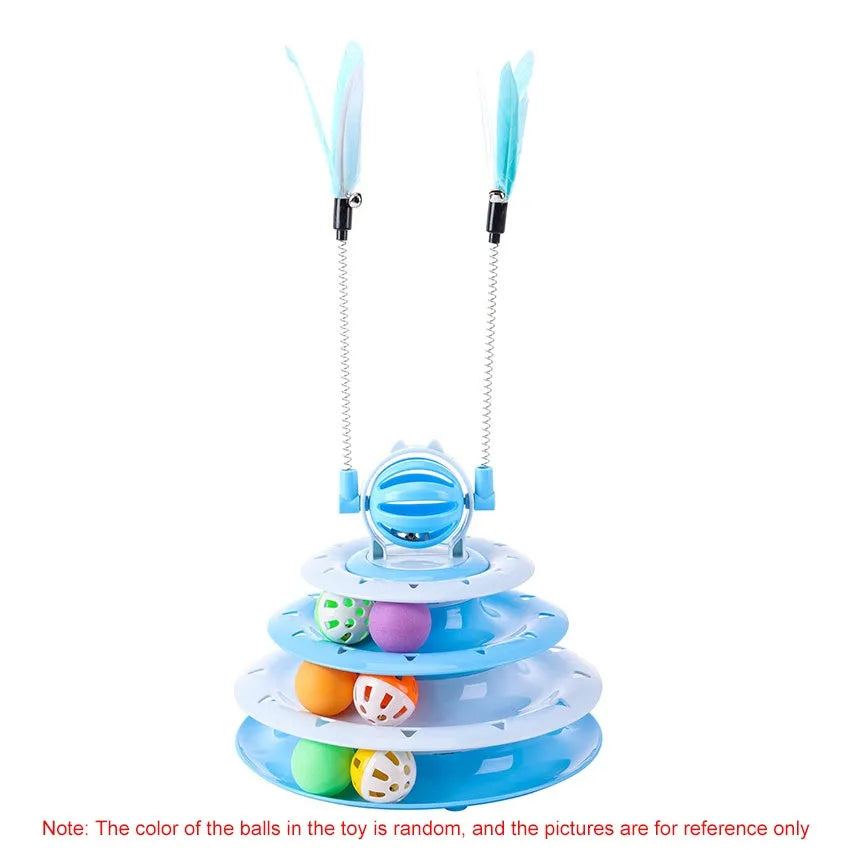 Blue four-tier interactive cat puzzle toy with rolling balls and teaser rods on a table.