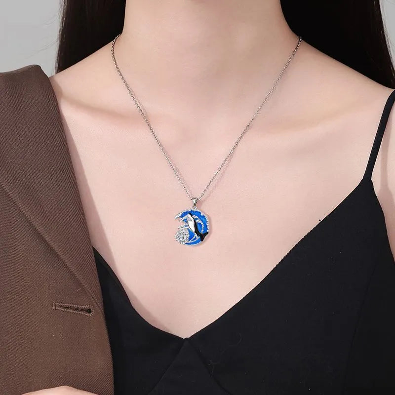 Copper shark pendant necklace with electroplated finish and adjustable cross chain measuring 41cm to 50cm