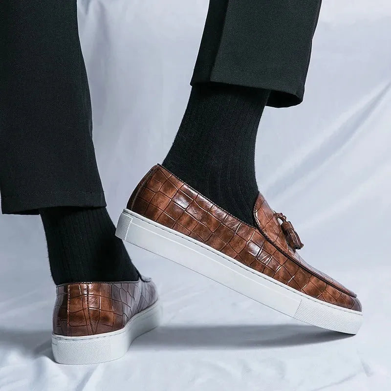 Men's plus size black tassel sneakers with round toe and oversleeve design on a rubber sole