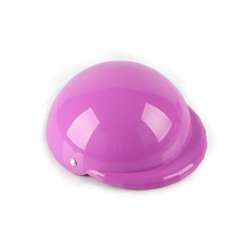 Plastic dog motorcycle cap helmet in assorted colours on a white background