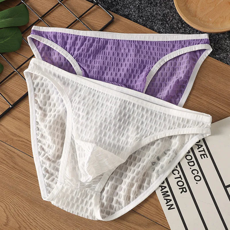 Men's low waist transparent lace underwear in black on a white background