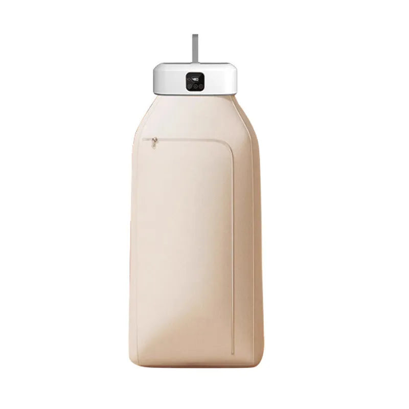 White cylindrical foldable clothes dryer with remote control on a table.