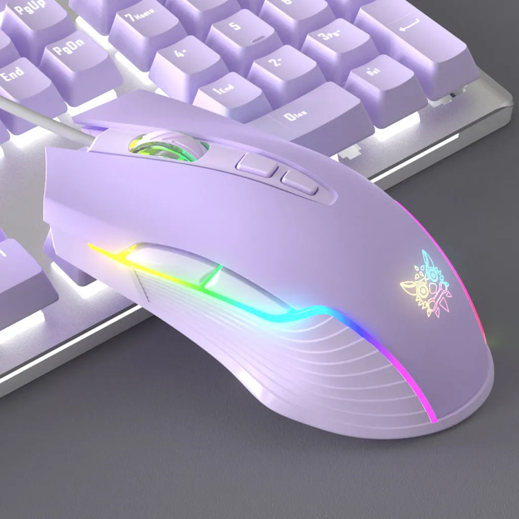 Purple and white mechanical keyboard and mouse combo set with backlit keys on desk