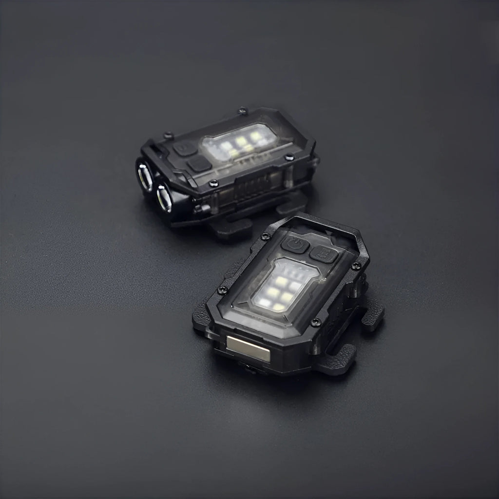Compact USB rechargeable tactical flashlight with a black mounting clip attached to a backpack strap.