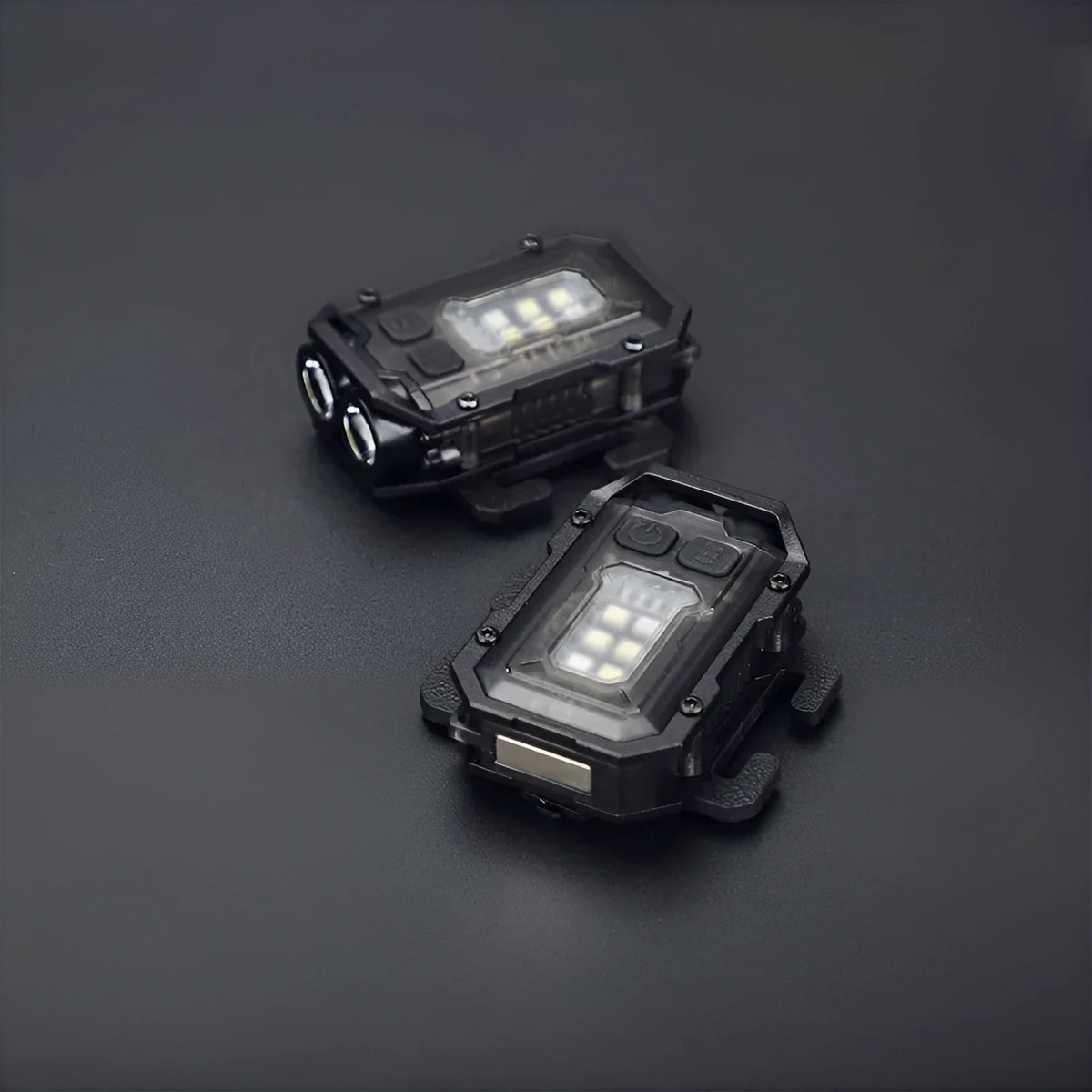 Compact USB rechargeable tactical flashlight with a black mounting clip attached to a backpack strap.