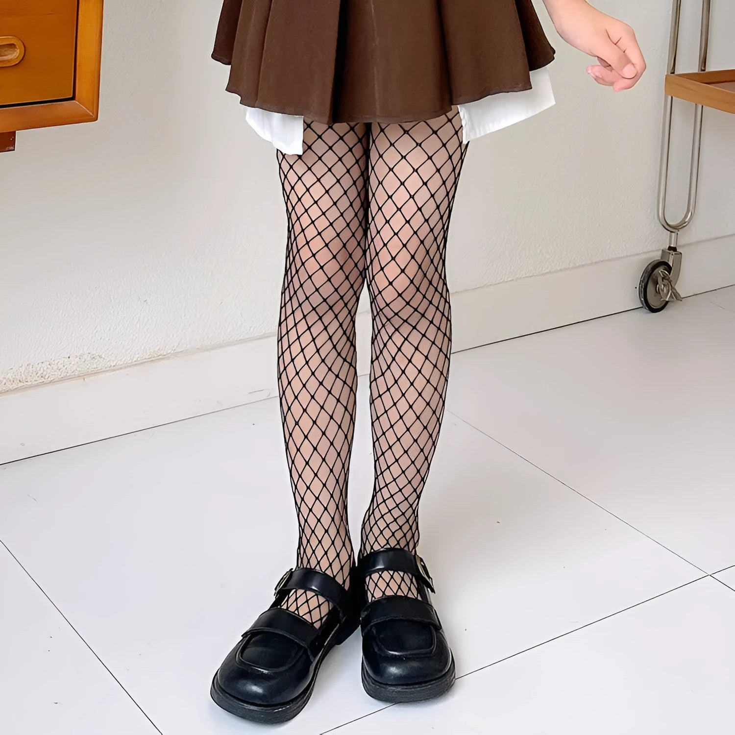 Women's summer stockings showing large, medium, and small mesh patterns in black and white colours.