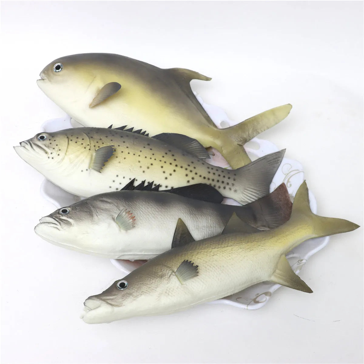 Set of three PU simulated fish models including yellow fin tuna, small tuna, and yellow croaker for display