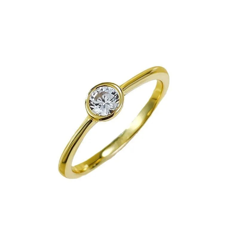 Minimalist silver crown-shaped ring with linear engraving detail in gold or platinum electroplated finish.