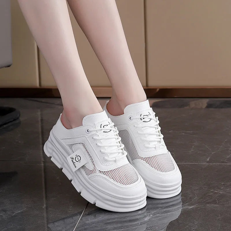 Women's black mesh half slippers with a round toe and rubber sole, shown on a white background.