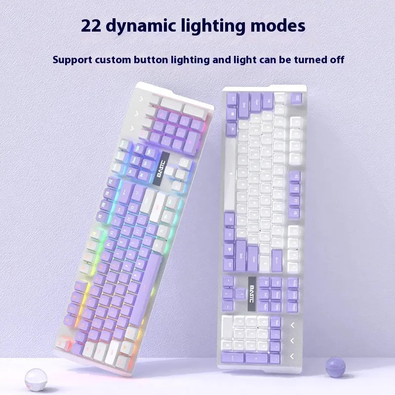 Purple and white mechanical keyboard and mouse combo set with backlit keys on desk