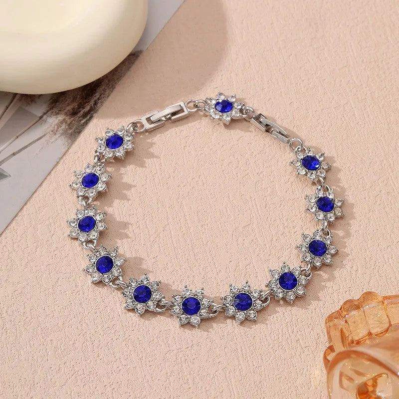 Flower charm bracelet in zinc alloy with electroplated finish and colourful crystal accents