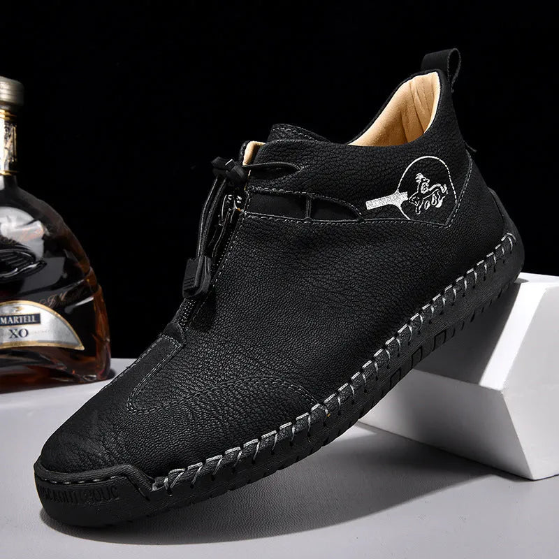 Men's casual leather shoes in black with a mid heel, rounded toe, and reinforced leather upper.