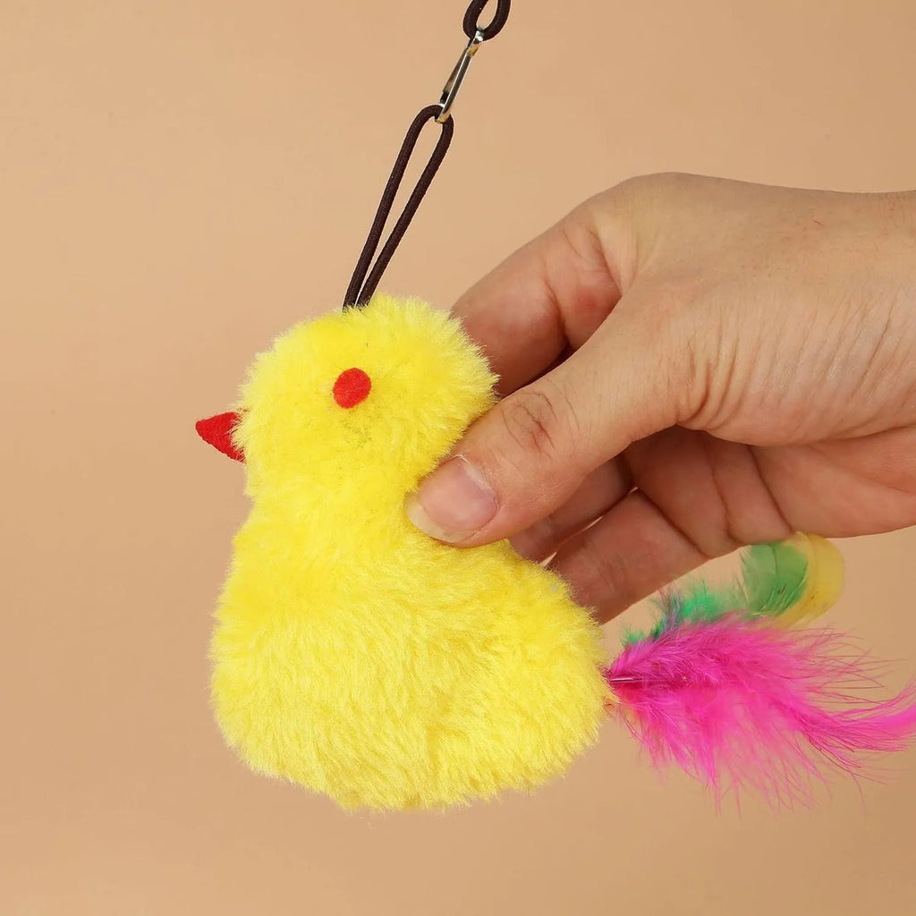 Interactive cat toy hanging on door frame with treat bulb and dangling mouse toy on elastic rope