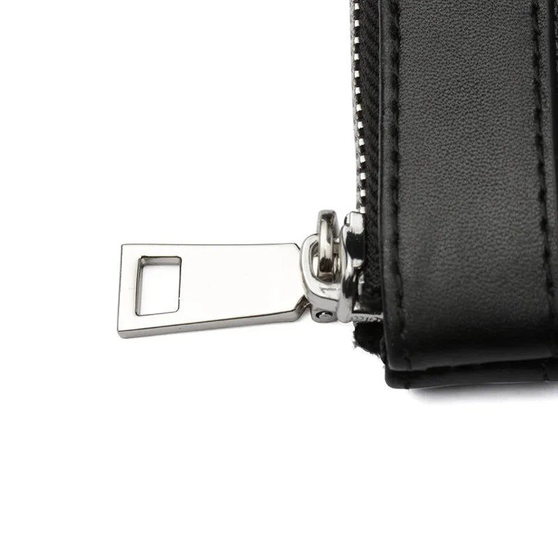 Black men's clutch wallet made from first layer cowhide leather, showing front view.