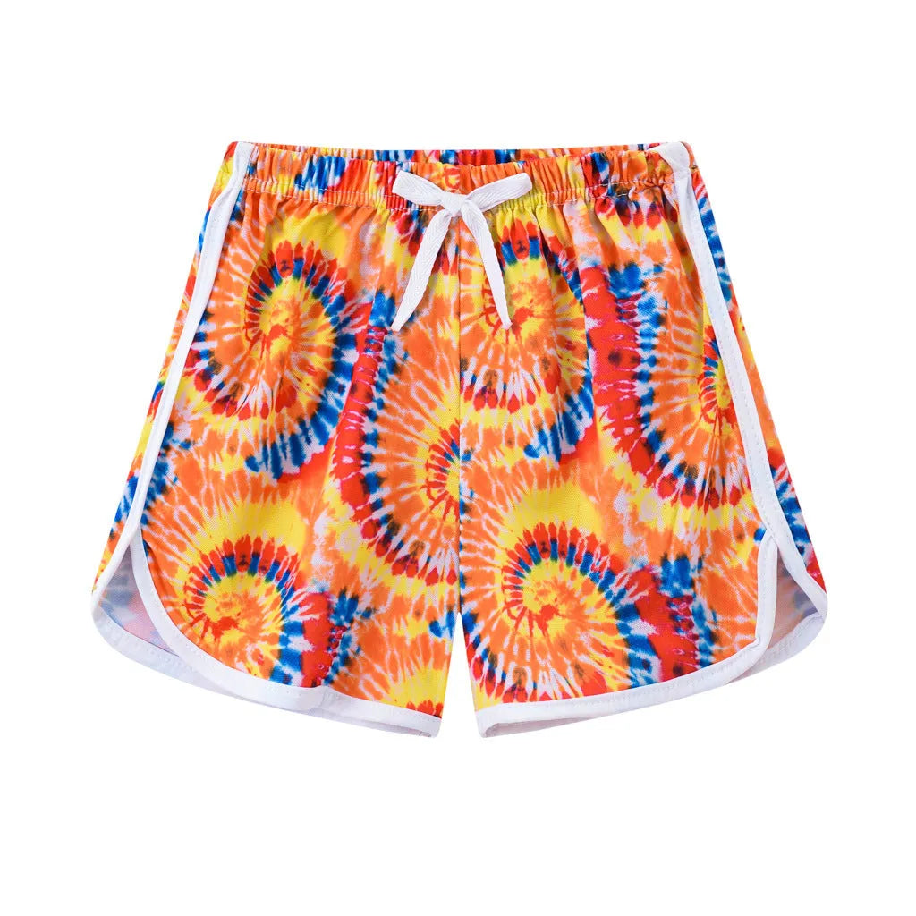 Children's colourful polyester beach shorts showing patterns like leopard print, stripes, and pineapples.