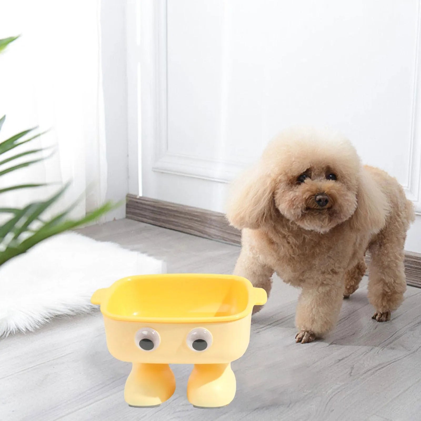 Green robot-shaped elevated cat bowl with tilted design and non-slip base