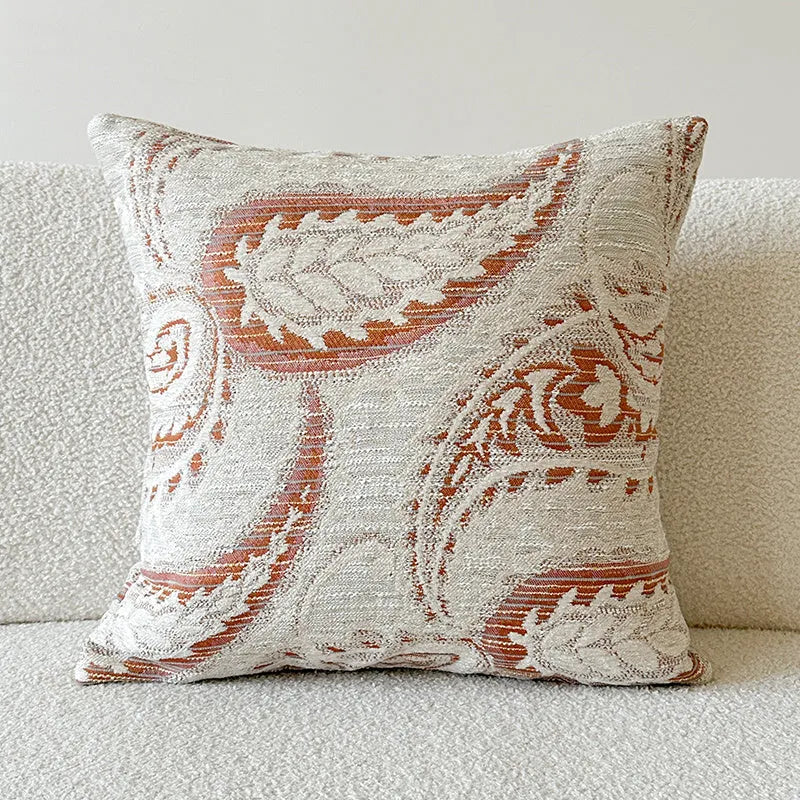 American-style jacquard cushion cover with a paisley and floral pattern in an amber colour.