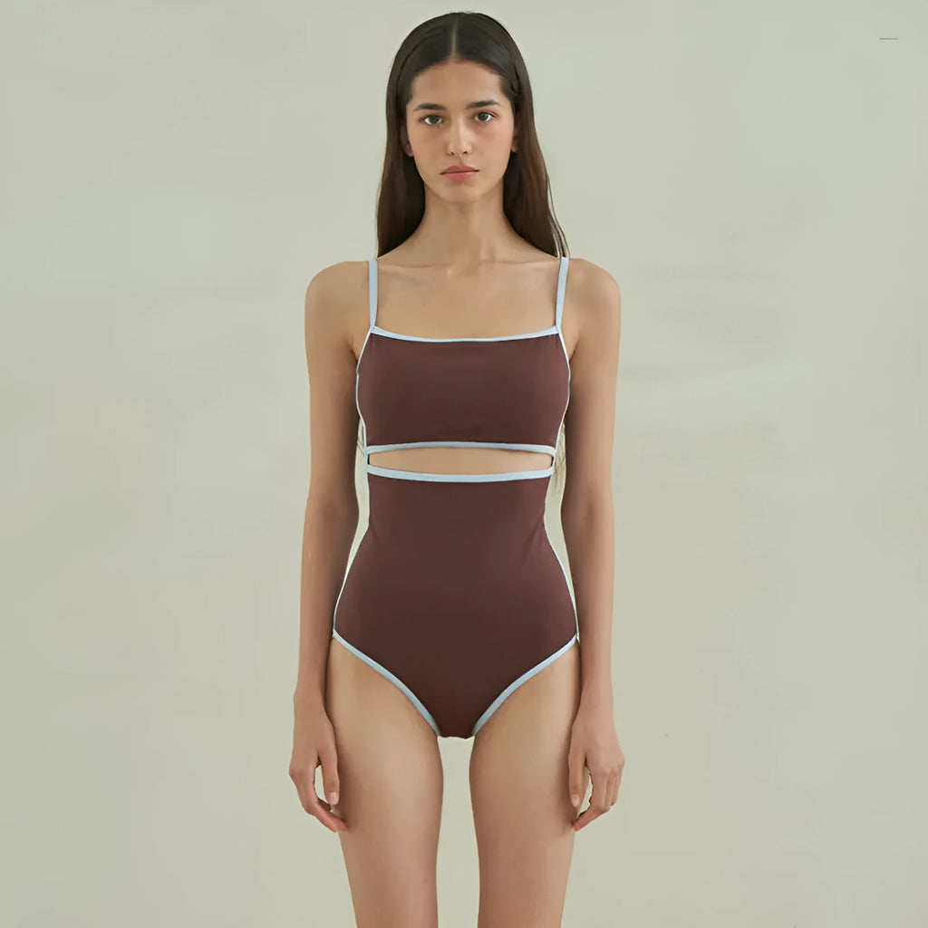 Brown women's one-piece swimsuit with triangle style on a hanger.