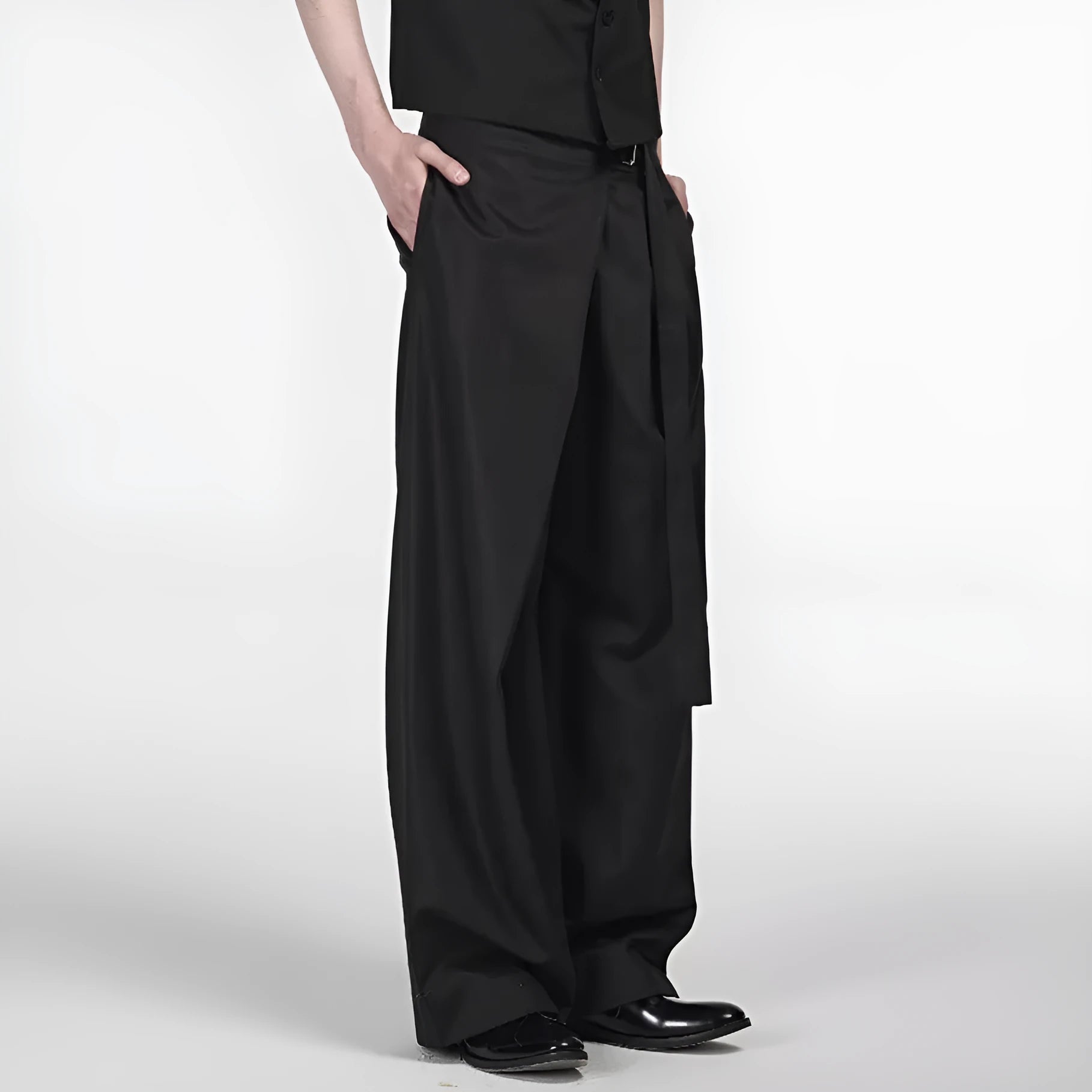 Black straight-leg trousers with a single front pleat and adjustable waistband on a hanger.