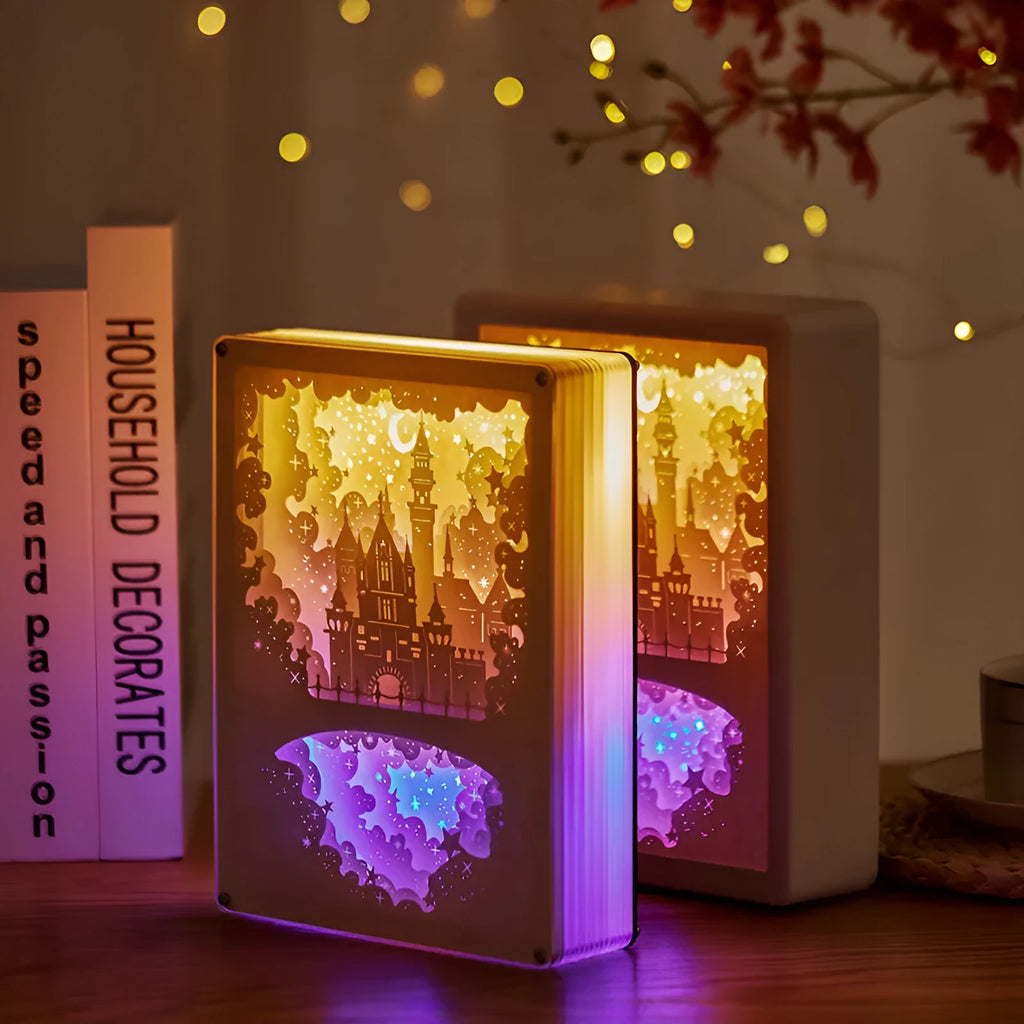 Three-dimensional paper carving USB bedside night light with remote control on wooden table