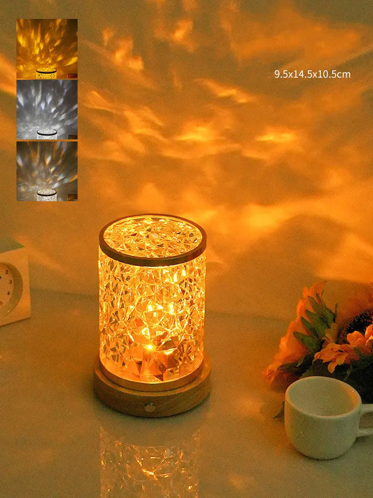 Small rotating water ripple night light on a solid wood base with touch control.